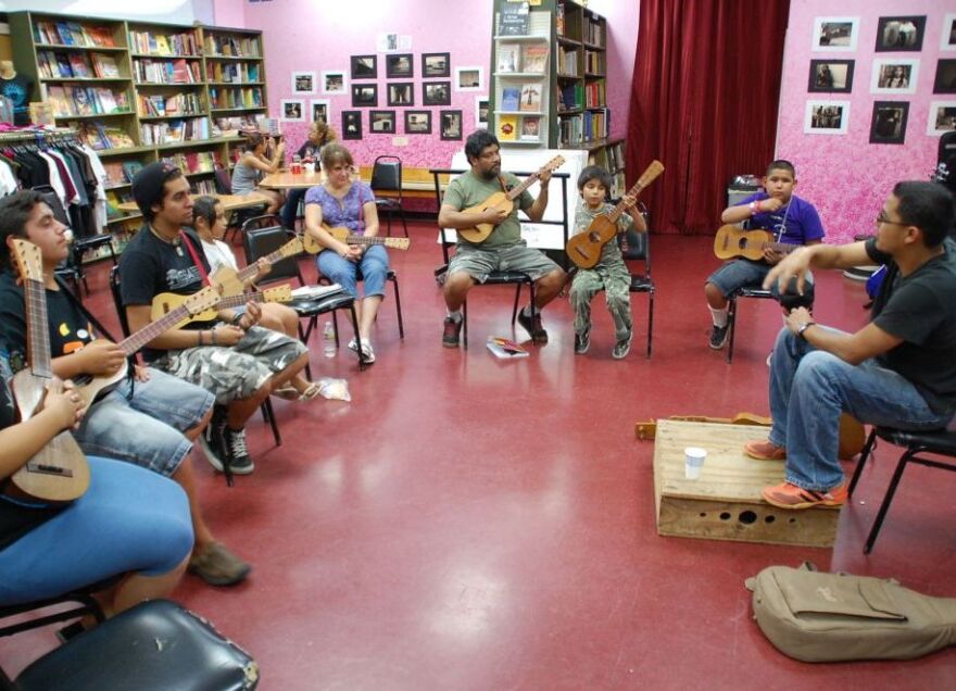 <p>Students learn the jarana in a Son Jarocho class at Tia Chucha's Centro Cultural & Bookstore in Sylmar, Los Angeles.</p>