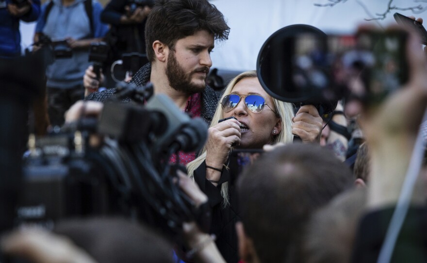 Rep. Marjorie Taylor Greene, R-Ga., speaks at a protest across the street from the Manhattan District Attorney's office in New York on Tuesday.