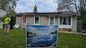 A house in Ann Arbor's Bryant neighborhood gets fitted with solar panels.