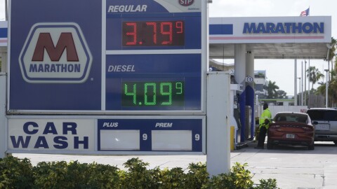 A customer pumps gas at a Marathon gas station, Tuesday, Aug. 22, 2023, in North Miami.