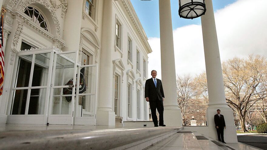 President George W. Bush waits on the North Portico for the arrival of Republican presidential nominee Sen. John McCain at the White House on March 5, 2008.