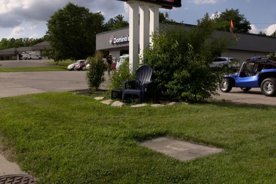 The grass location outside of the Ellettsville's Dominos where Joseph Charles Tindal and Gibson Bell stood as sign holders when the accident occurred.