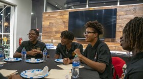 Milwaukee Public Schools students attend a community conversation with Milwaukee Bucks basketball player Cameron Payne at the American Black Holocaust Museum in Milwaukee. The conversation was part of a mentoring program through the school district’s Department of Black and Latino Male Achievement.