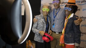 Joseph Jones, an Amazon employee on the marketing team for Amazon channels, takes pictures with his mother, Cathy Jones, right, and his grandmother, Hattie Perry, left, during Amazon's bring your parents to work day on Friday, September 15, 2017.