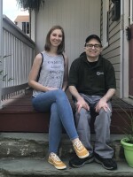 Ashley Merson and her brother Kevin sit on the porch of the house Ashley is trying to buy in the Hampden neighborhood of Baltimore. A ransomware attack on the city's digital services has delayed the home purchase.