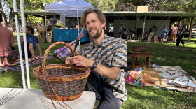 Artist Jeff Wagner weaving a basket at Mountain Harvest Festival.
