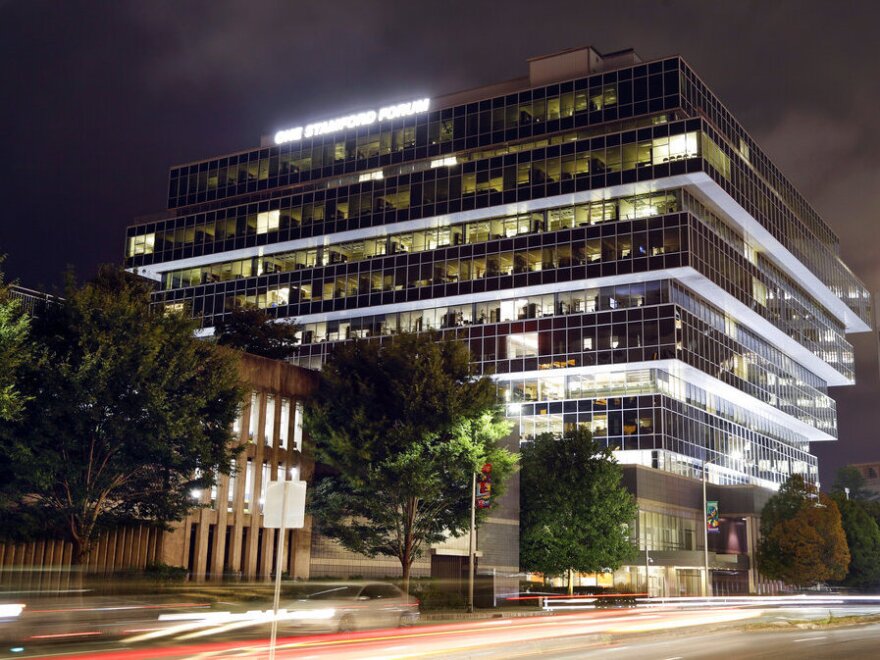 Cars pass Purdue Pharma headquarters, Sept. 12, 2019, in Stamford, Conn. A federal mediator is expected to announce Wednesday, Feb. 16, 2022 or Thursday whether Purdue Pharma and a group of holdout state attorneys general have been able to reach a new settlement in the OxyContin maker's bankruptcy case.