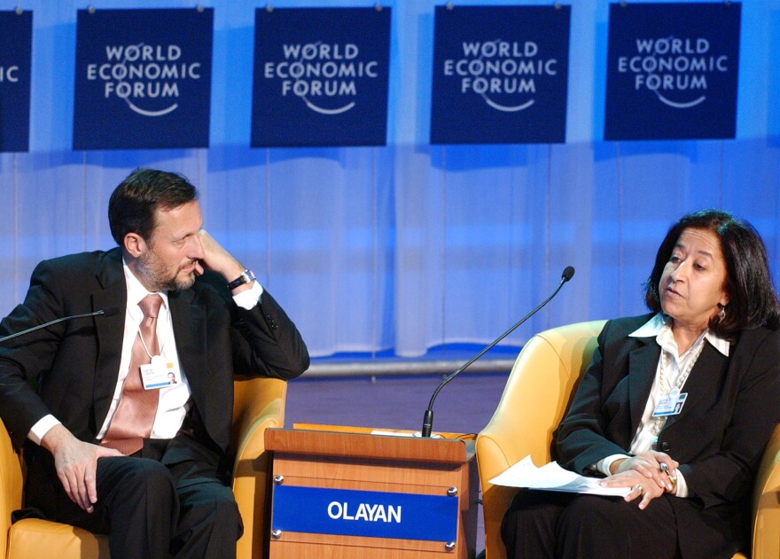 Lubna Olayan speaks, alongside then-CEO of pharmaceutical company Novartis, Daniel Vasella, during the 2005 World Economic Forum in Davos, Switzerland.