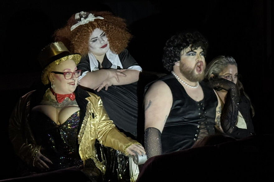 From left, Chyna Morgan Mahan, Courtney Vinzant and Logan Parks play Magenta, Columbia and Dr. Frank-N-Furter in a shadow cast production of "The Rocky Horror Picture Show" on Thursday, Oct. 29, 2026 near Soldotna, Alaska.