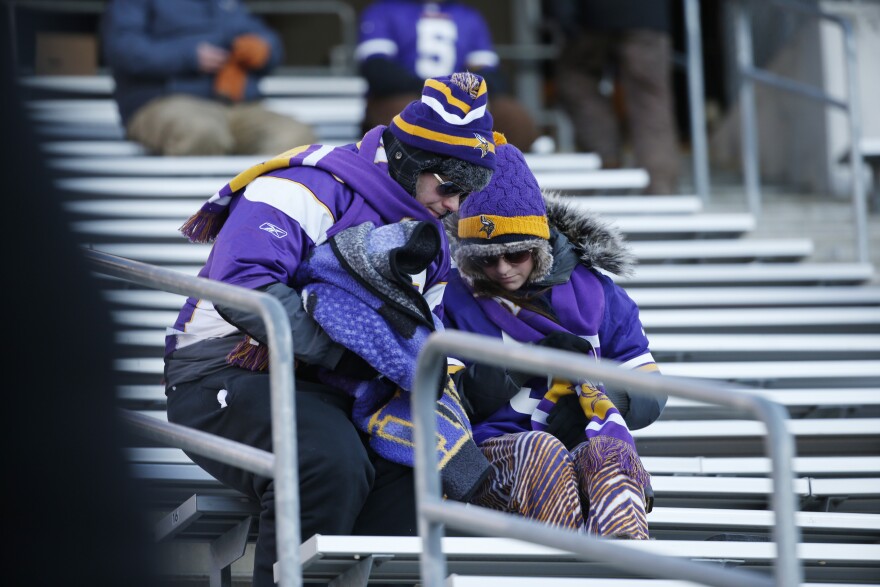 Minnesota Vikings fans sit ithe stands after an NFL wild-card football game against the Seattle Seahawks, Sunday, Jan. 10, 2016, in Minneapolis. The Seahawks won 10-9.