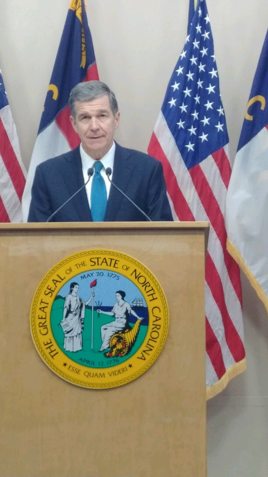 Gov. Roy Cooper addresses reporters on Tuesday, December 18, 2018.