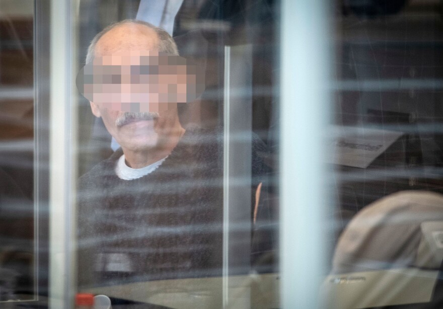 Syrian defendant Anwar Raslan arrives in court in Koblenz, Germany, on April 23, 2020. German prosecutors accuse him of crimes against humanity and other crimes for overseeing systematic torture and abuse of more than 4,000 prisoners, which prosecutors say led to 58 deaths.