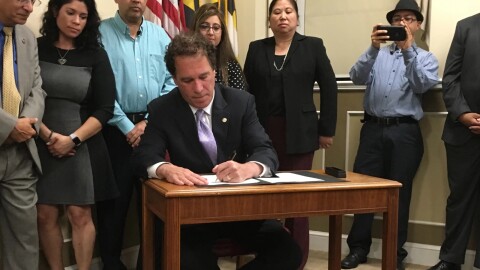Baltimore County Executive Kevin Kamenetz signs an executive order in April 2017 "Upholding Law Enforcement Standards on Immigration Status, Diversity and Equity." 