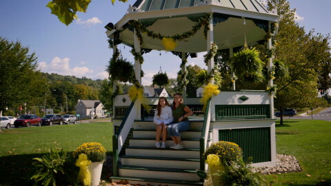 Fans pose for a photo at the gazebo in New Milford during their “A Weekend in the Life” event.