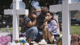 <strong>May 26:</strong> People visit a memorial in the town square for victims of Tuesday's mass shooting at Robb Elementary School.