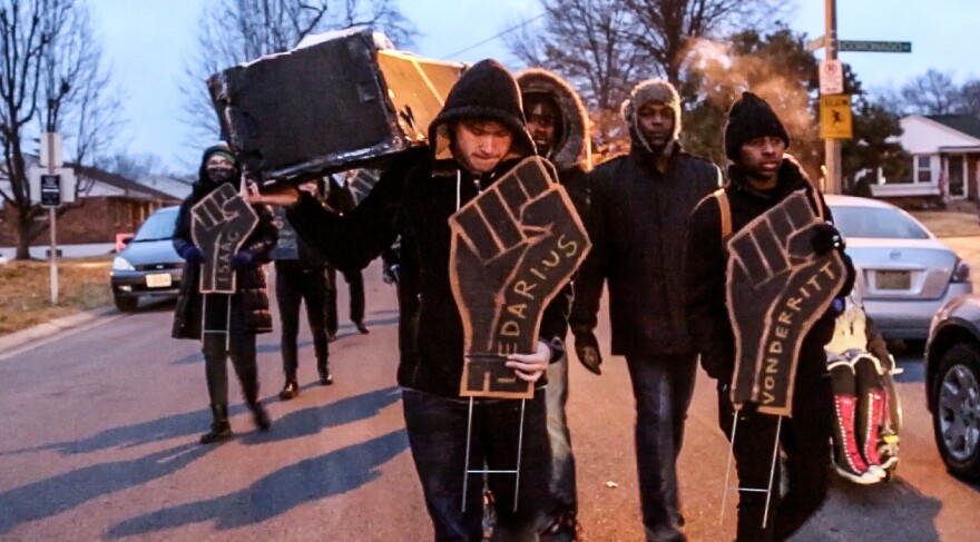 Activists led a “funeral march” down Mayor Francis Slay’s street in South St. Louis early on the morning of Feb. 9, 2015, and left a cardboard coffin on his doorstep. They also stuck signs in his yard with the names of those recently shot and killed by St. Louis city police, along with another sign that said, “They tried to bury us but didn’t know we are seeds.” Among their demands for Slay was passage of the civilian oversight legislation.