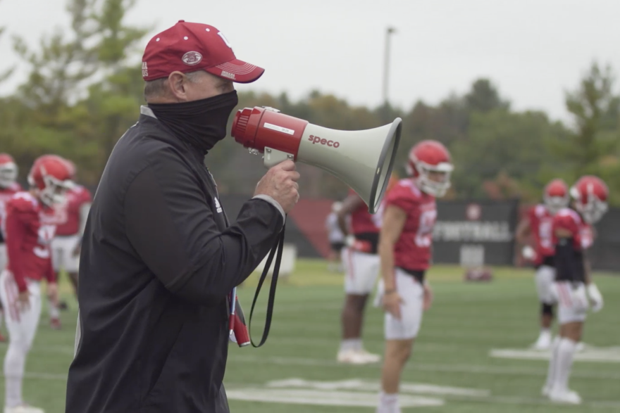 Indiana coach Tom Allen barks out instructions through a megaphone at practice.