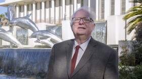 Bill Cotterell in front of the building he covered with such relentless energy.