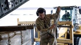 Alaska Air National Guard C-17 Globemaster III aircrew, assigned to the 176th Wing, offload gear and supplies at Bethel, Alaska, while supporting storm recovery operations following Typhoon Halong, Oct. 15, 2025.