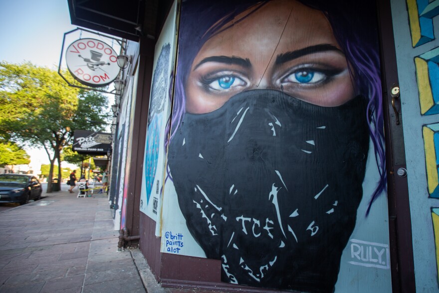 Murals adorn closed businesses in downtown Austin during the coronavirus pandemic.