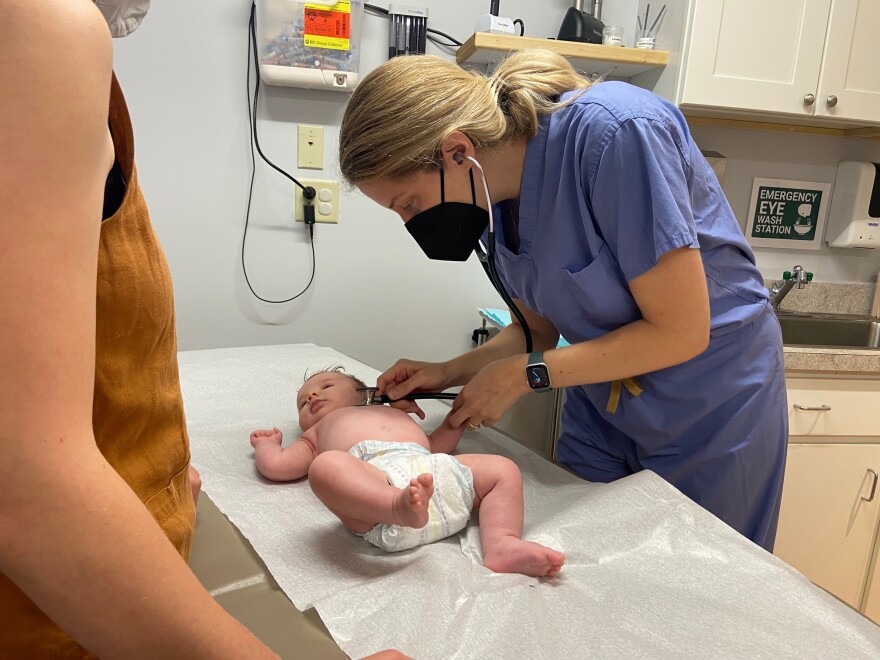 Physician assistant Sarah Vacca with her patient, Summer.