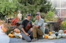 Sherri and Kevin Kukuchka, owners of Creekside Gardens, kneel in front of the entrance of the Pumpkin Walk. The annual event brings hundreds of families to Tunkhannock to see the pumpkin display.