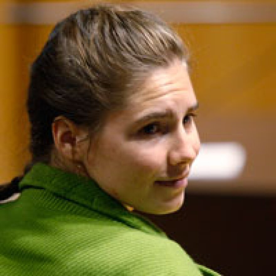 Murder suspect Amanda Knox turns around during a final hearing Friday at the court in Perugia, Italy. An Italian jury has begun deliberations in the yearlong trial of the American student, who is charged with murdering her British roommate Meredith Kercher in 2007 with her former boyfriend, Italian Raffaele Sollecito.