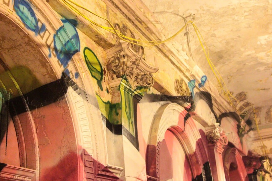 Graffiti on the first floor of the Divine Lorraine. (Dean Russell/Here & Now)