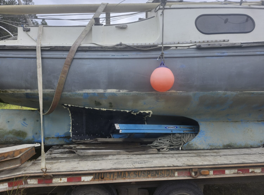 The Gustavus family’s sailboat with a large patch over the hole where the whale struck it. Courtesy of Lu Syrene
