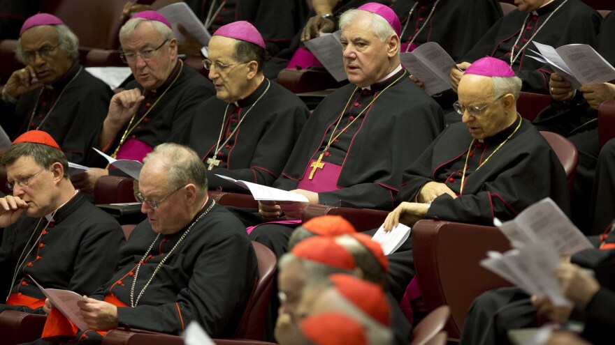 Bishops, wearing purple skull caps, are shown on Thursday at the Vatican. They were elevated to cardinals in a ceremony Saturday.