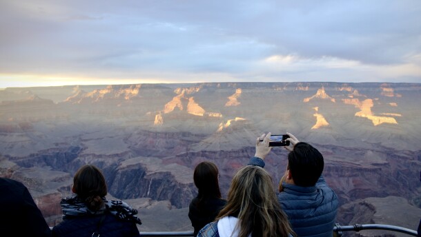 Tourists visit the South Rim of the Grand Canyon on November 1, 2022. The portion of the Colorado River which runs through the canyon is receiving a boost of water designed to rebuild beaches and sandbars.