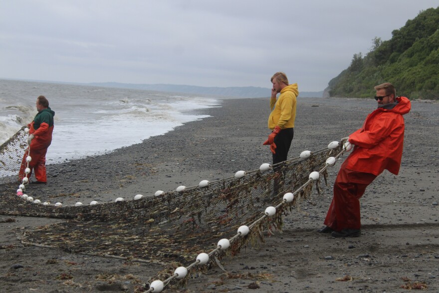 Carey Johnson (right) helps pull in a beach seine net on Wednesday, July 9, 2025 in Clam Gulch, Alaska.