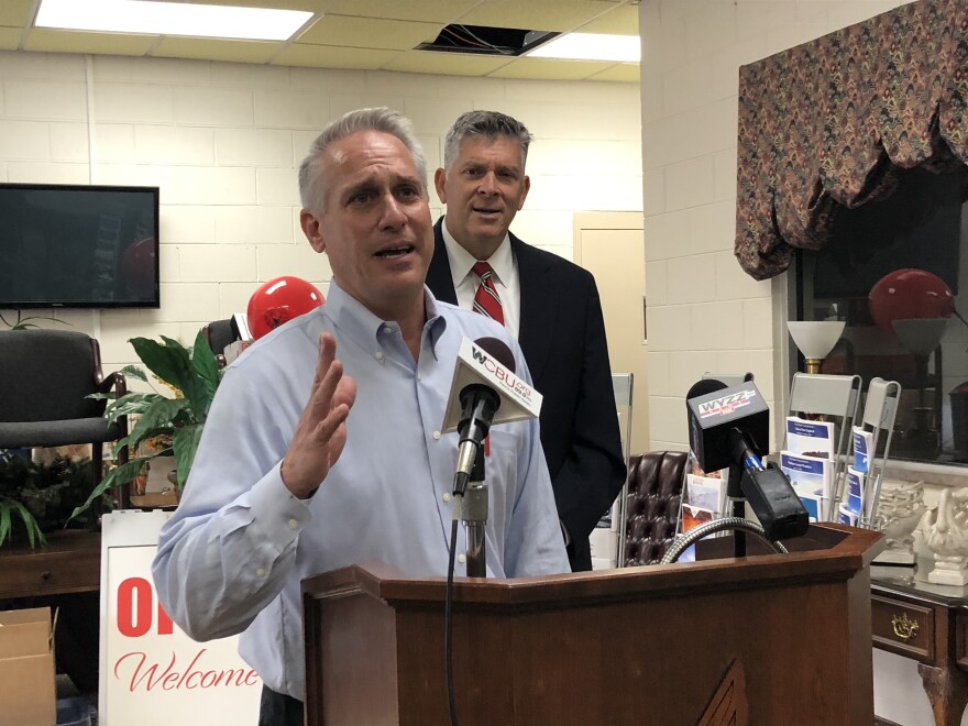 Peoria Charter Coach president Bill Winkler discusses the bus company's $2 million in Coronavirus Economic Relief for Transportation Services Act grant as U.S. Rep. Darin LaHood, R-Peoria, looks on during a news conference Monday in Peoria.