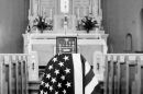 The empty flag-draped casket of Paul Hasenbeck rests in the center of the church on Saturday, May 11, 1974, at the Holy Family parish in Freeburg. The state of Missouri declares residents dead after seven years of being unaccounted for; Hasenbeck went missing on April 21, 1967, and was declared dead in 1974. A funeral was held on his birthday the following month.