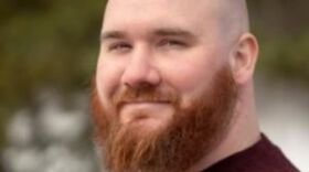 a portrait of a man outside