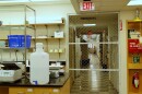 A metal gate standing in the doorway of a biology lab