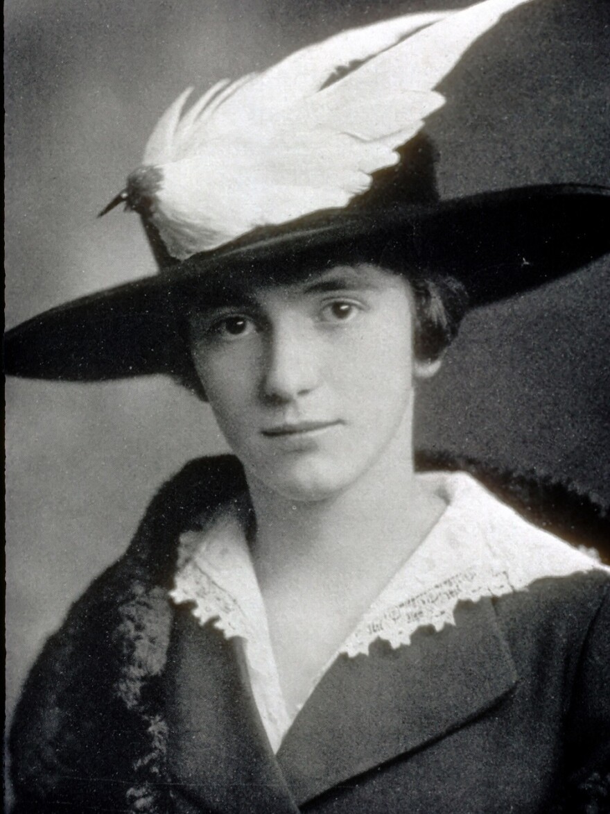 Woman in a bird hat.