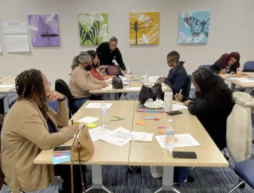 Attendees at a Queens Village Dayton co-design session work on a plan to support the health of local women and infants.