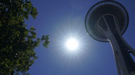 The sun shines near the Space Needle on Monday, June 28, in Seattle. Seattle and other Northwest cities broke all-time heat records over the weekend.