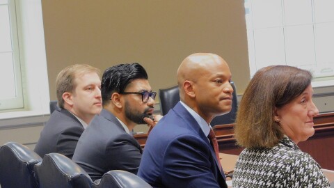 From left to right: Senior Policy Advisor for the Maryland Department of Transportation Drew Morrison, Deputy Legislative Officer Saif Ratul, Gov. Wes Moore and Maryland Department of Transportation Acting Secretary Kathryn Thomson testify in favor of the Protection from Predatory Pricing Act and the Maryland Transit and Housing Opportunity Act on Tuesday in the Lowe House Office Building in Annapolis, Md.