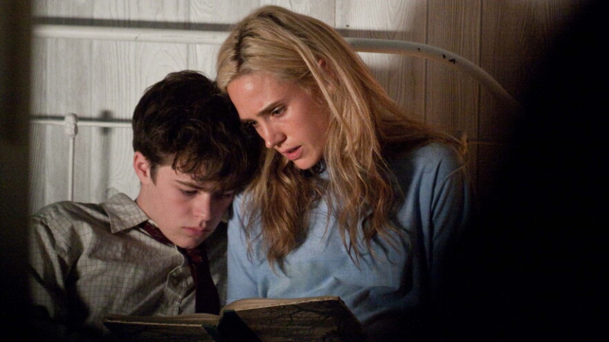 Single mother Virginina (Jennifer Connelly) reads with her son, Emmett (Harrison Gilbertson), who remains devoted to her even when her ill-advised affair with the married sheriff of their small Virginia town puts pressure on her family.
