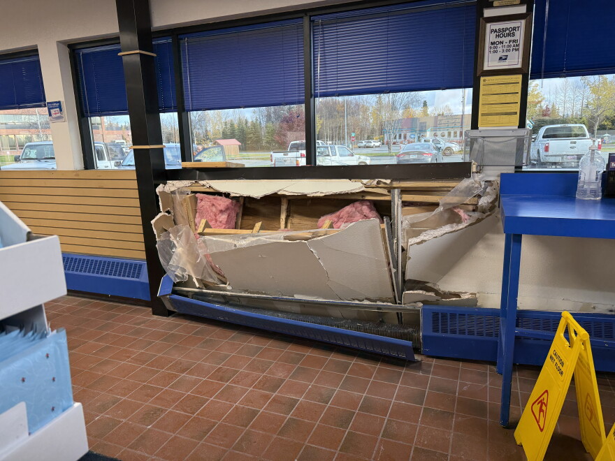 Insulation protrudes from the wall of the Kenai Post Office following a vehicle collision on Tuesday, Oct. 13, 2026 in Kenai, Alaska.