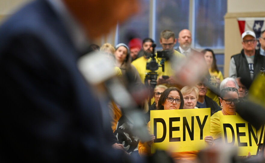 People packed the third floor gym of the Archbald borough building holding signs that urged council to deny zoning for a data center campus.
