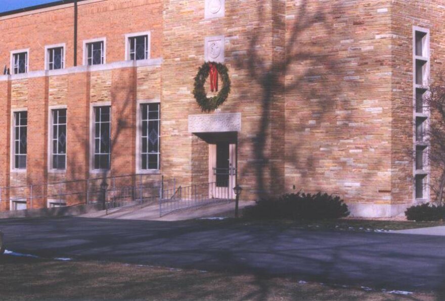 Image of a school building with a wreath above the door It's the old Trinity Lutheran in Bloomington.