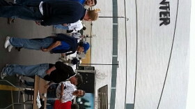 People wait in the beer line across the street from the BOK Center