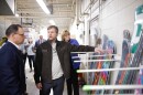 Pennsylvania Governor Josh Shapiro, left, is shown snowboards made at Gilson Snow by owner, Nick Gilson. Pennsylvania Department of Conservation and Natural Resources Secretary Cindy Adams Dunn looks on.