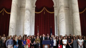 Sen. Jerry Moran, R-Kansas, center left, and Sen. Richard Blumenthal, D-Conn., attend a news conference with dozens of women and girls who were sexually abused by Larry Nassar, a former doctor for Michigan State University athletics and USA Gymnastics, July 24, 2018, on Capitol Hill in Washington.