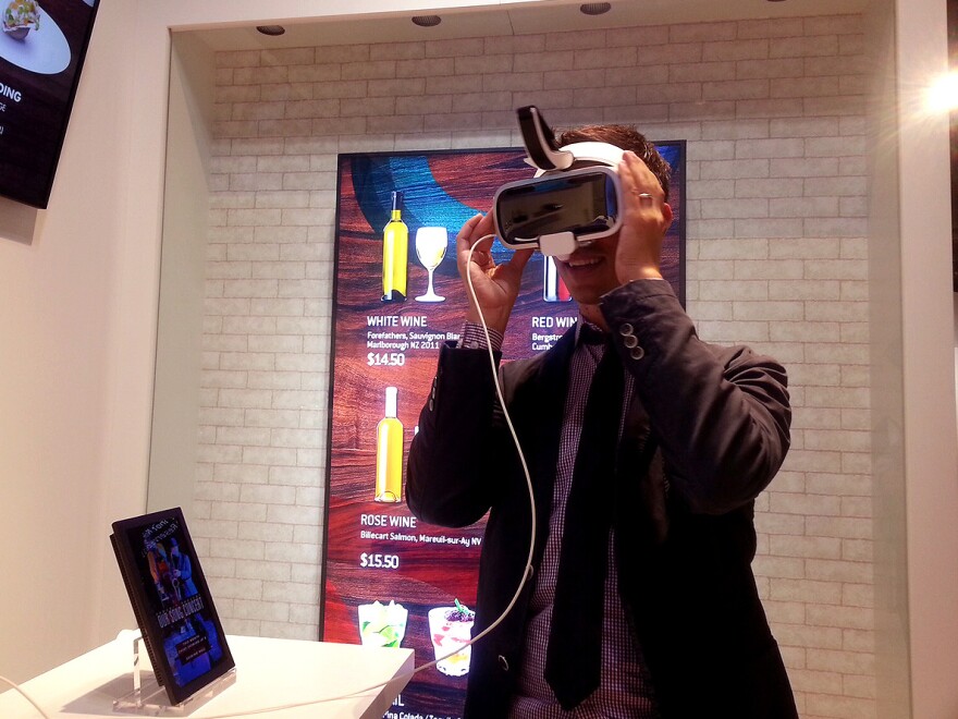 NPR reporter Ari Shapiro tries virtual reality goggles at the Samsung Innovation Museum near Seoul.