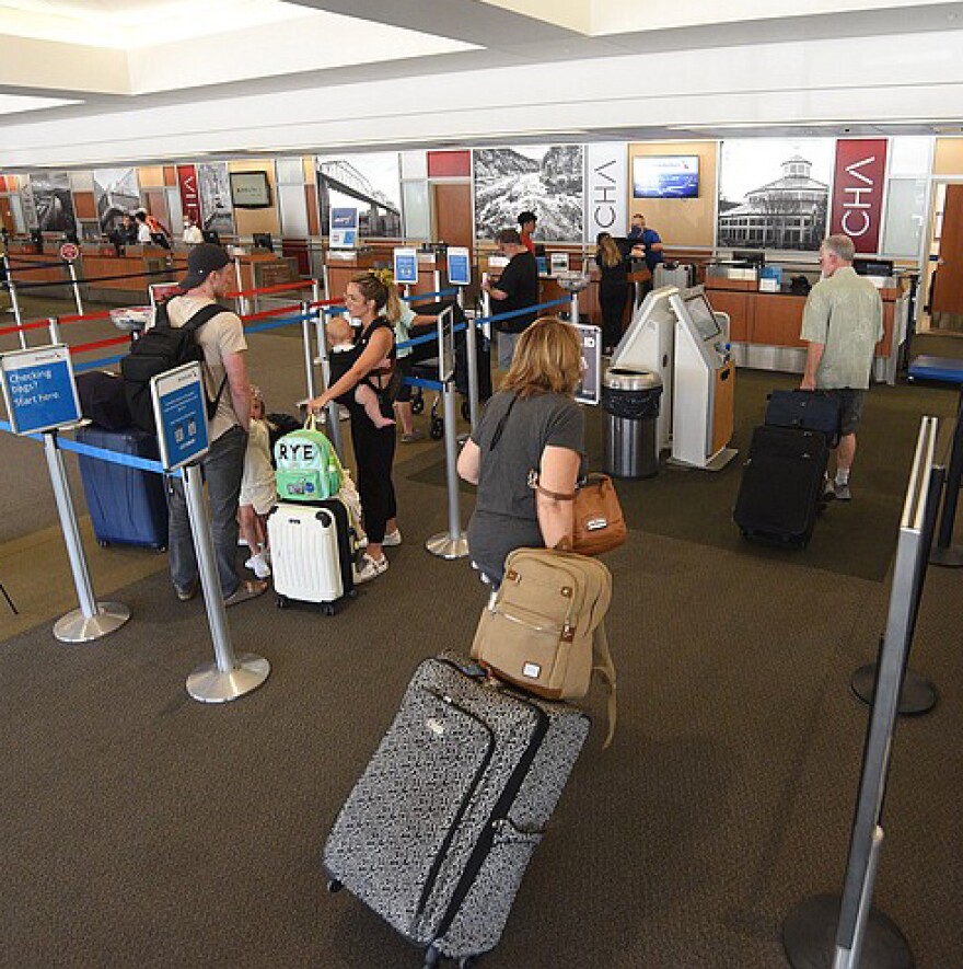 Passengers line up to check their luggage at Chattanooga Airport in June 2022.