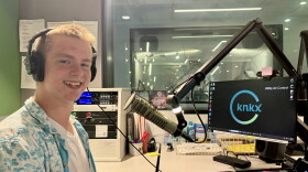 DJ Ross Gawthrop behind the microphone in the KNKX studios.